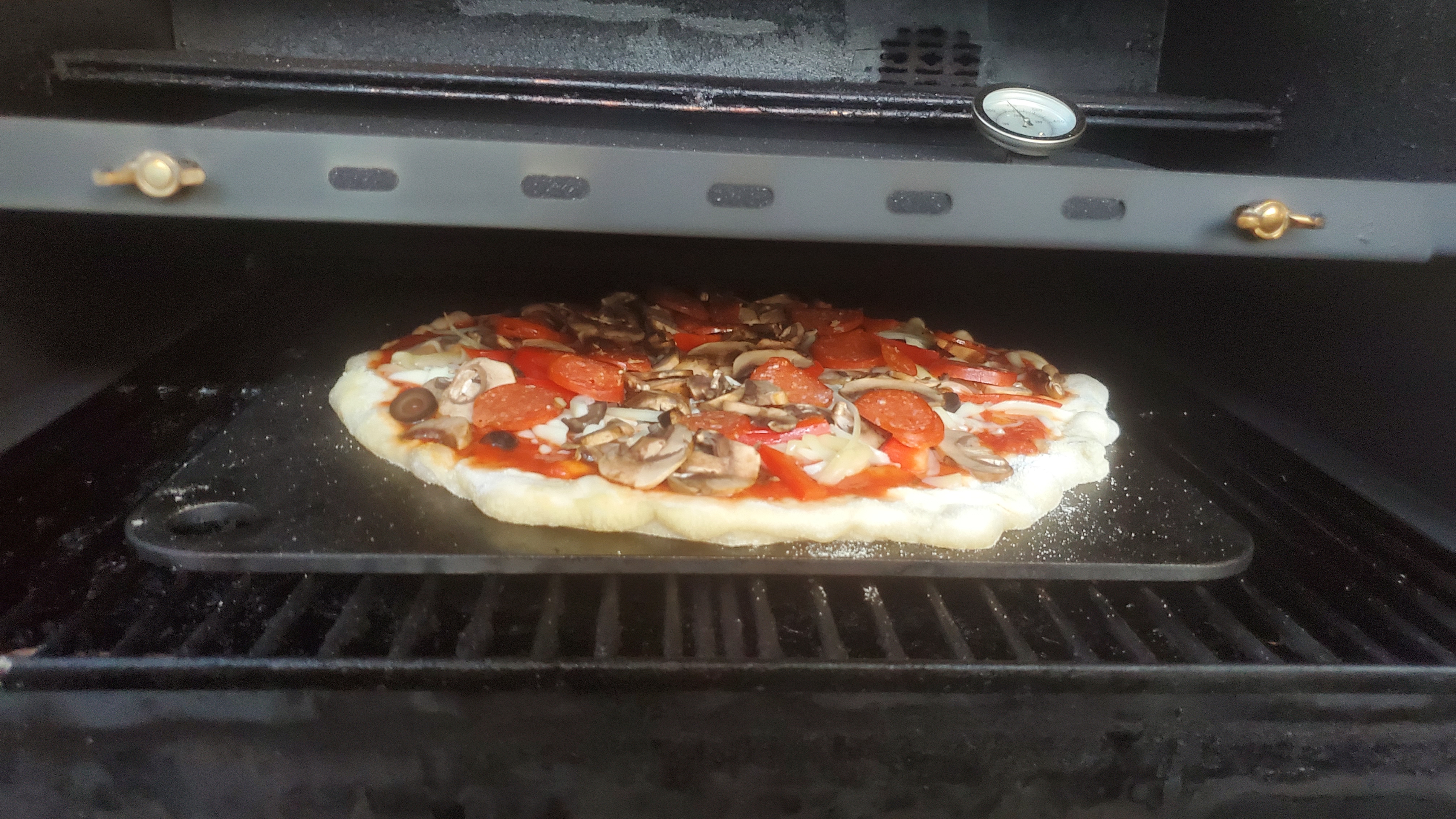 On the pellet smoker using a steel and the pizza box